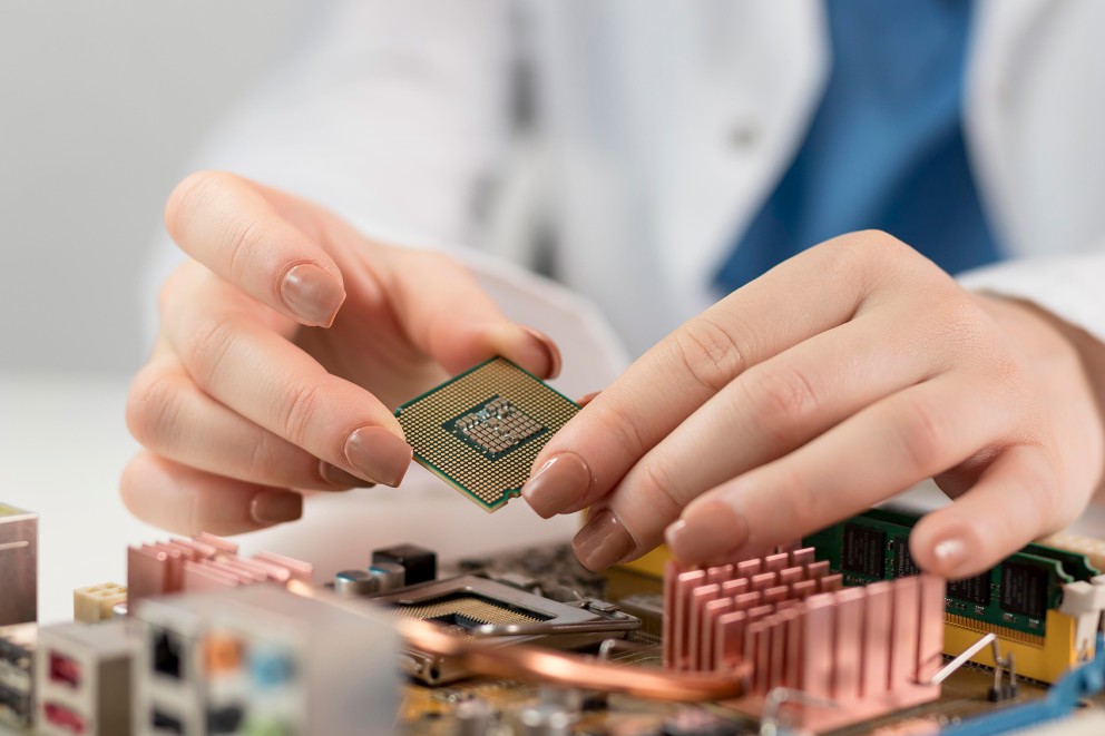 scientist holding microchip